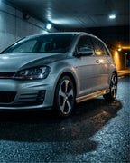 VW Golf MK7 GTI Carbon Fiber Side Skirt Extensions – Gloss Black (2014–2016)