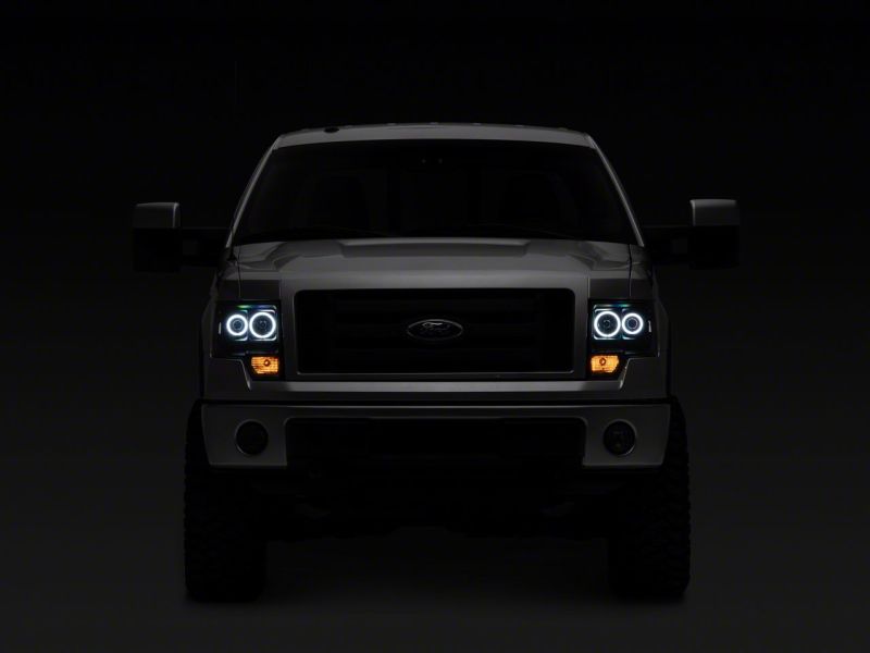 Raxiom 09-14 Ford F-150 Super White LED Halo Projector Headlights- Blk Housing (Clear Lens)