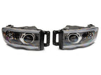 Raxiom 02-05 Dodge RAM 1500/2500/3500 Axial LED Projector Headlights- Black Housing (Clear Lens)