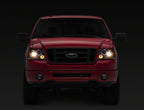Raxiom 04-08 Ford F-150 Dual LED Halo Projector Headlights- Chrome Housing (Clear Lens)