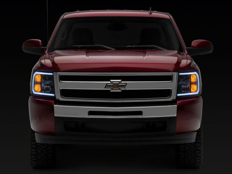 Raxiom 07-13 Chevrolet Silverado 1500 Axial Headlights w/ SEQL LED Bar- Black Housing (Clear Lens)