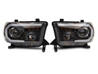 Raxiom 07-13 Toyota Tundra Axial Projector Headlights w/ SEQL LED Bar- Black Housing (Clear Lens)