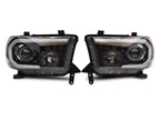 Raxiom 07-13 Toyota Tundra Axial Projector Headlights w/ SEQL LED Bar- Black Housing (Clear Lens)