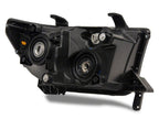 Raxiom 07-13 Toyota Tundra Axial Series Headlights w/ SEQL LED Bar- Black Housing (Clear Lens)