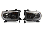 Raxiom 07-13 Toyota Tundra Axial Series Headlights w/ SEQL LED Bar- Black Housing (Clear Lens)