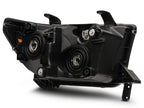 Raxiom 07-13 Toyota Tundra Axial Series Projector Headlights w/ LED Bar- Black Housing (Clear Lens)
