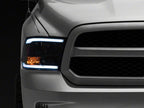 Raxiom 09-18 Dodge RAM 1500/2500/3500 Axial Headlights w/ SEQL LED Bar- Black Housing (Clear Lens)