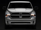 Raxiom 09-18 Dodge RAM 1500/2500/3500 Axial Series Headlights w/ LED Bar- Black Housing (Clear Lens)