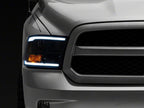 Raxiom 09-18 Dodge RAM 1500/2500/3500 Axial Series Headlights w/ LED Bar- Black Housing (Clear Lens)