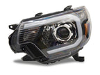Raxiom 12-15 Toyota Tacoma Axial Projector Headlights w/ SEQL LED Bar- Black Housing (Clear Lens)