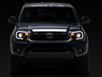 Raxiom 12-15 Toyota Tacoma Axial Projector Headlights w/ SEQL LED Bar- Black Housing (Clear Lens)