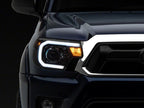 Raxiom 12-15 Toyota Tacoma Axial Series Projector Headlights w/ LED Bar- Black Housing (Clear Lens)