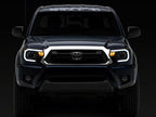 Raxiom 12-15 Toyota Tacoma Axial Series Projector Headlights w/ LED Bar- Black Housing (Clear Lens)
