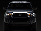 Raxiom 12-15 Toyota Tacoma Axial Series Projector Headlights w/ LED Bar- Black Housing (Clear Lens)