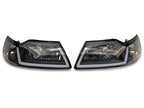 Raxiom 99-04 Ford Mustang Axial Series Headlights w/ Sequential LED Bar- Black Housing (Clear Lens)